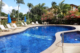 A/C throughout spacious clean comfortable main floor condo with lush garden view