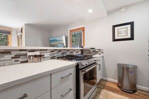 Kitchen with brand new appliances and gas range