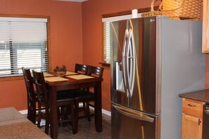 Eating area in kitchen with seating for 4.