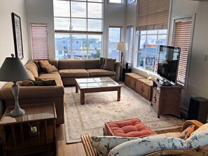 Living room with 12' windows and plenty of seating