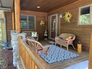 Front porch is perfect for relaxing with friends and family.