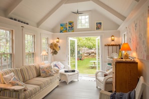 Sunroom off of the kitchen with view of garden and Baa Boys pen..