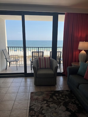 Sliding glass doors out to the oceanfront balcony.