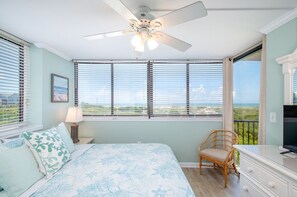 Oceanfront primary bedroom with king-sized bed