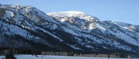 Winter scene of ranch and Jackson Hole ski area from condo