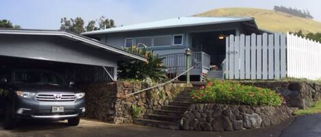 Waimea Ohana Hale nestled at the foot of Buster Brown, a cinder cone in back.