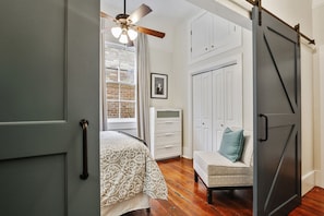 Sliding barn doors open to double bedroom