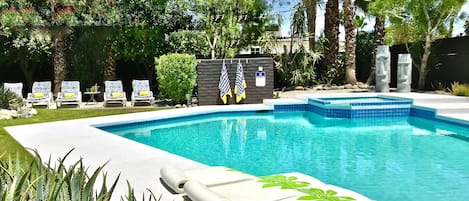 Enjoy and lounge in the expansive private backyard with large pool and jacuzzi.