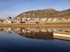 View from our 23' boat slip.  Our red home is beside the beige lake front home