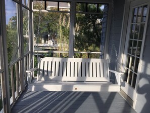 Relax with your coffee or a good book on the front porch swing