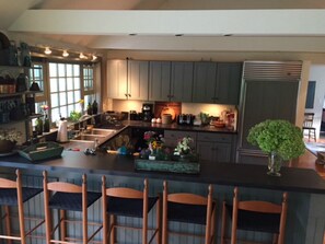 Kitchen bar seats five. Kitchen has great prep space. 