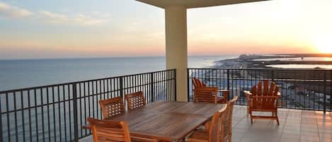 Balcony retreat with teak table and comfy deck furniture; just add you!