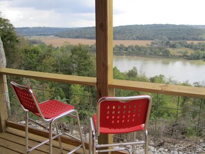 Deck overlooks Ohio River and serene Kentucky farmland.