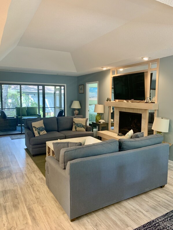 Bright and open Sparrow Pond Cottage with comfy living room and flat screen TV.