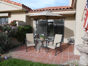 Large Sun Umbrella enhances your pleasure on the Back Patio on the Third Green.