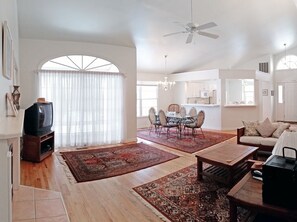 2nd view of living room from entrance to twin bedroom and hall to 2nd bath.