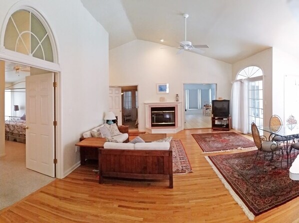 Living room from front door. To the left is master suite. Twin BR & Back porch.