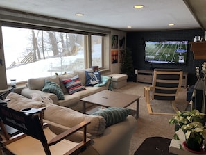 A 70" HDTV awaits in the downstairs living room.