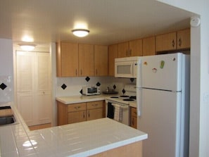 Full kitchen, stove, oven, fridge, microwave, toaster oven coffee maker.