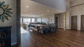 Looking into the dining area and main floor living room from the home entryway