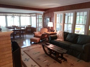 Falconhurst Living room with dining area overlooking the lake. View # 2