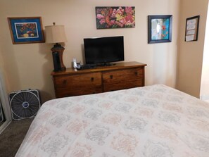 TV in the bedroom ... works by local artists ... and a fan to keep you cool!