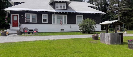 Cozy home sitting on 3 acres with screened in porch
