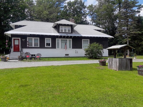 Cozy home sitting on 3 acres with screened in porch