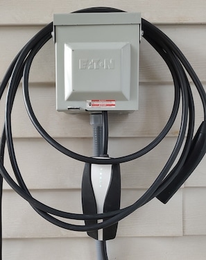 Garage equipped with 240V 50 Amp (NEMA 14-50) outlet. Perfect for Level 2 EV.