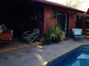 french doors leading from bedroom to pool patio