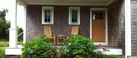 Front deck with cedar chairs and table