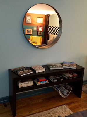 Entranceway with books about NYC and Harlem, as well as local magazines and maps