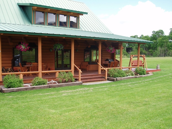 The summer porch at Canyon Ranch Lodge for kicking back and taking in the view