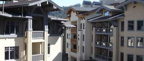 View of mountain peaks and village plaza from unit. 