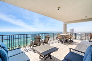 A variety of comfortable seating on a 700 sq. ft. balcony overlooking the beach!