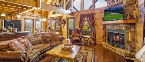 Large main level living room with fireplace.