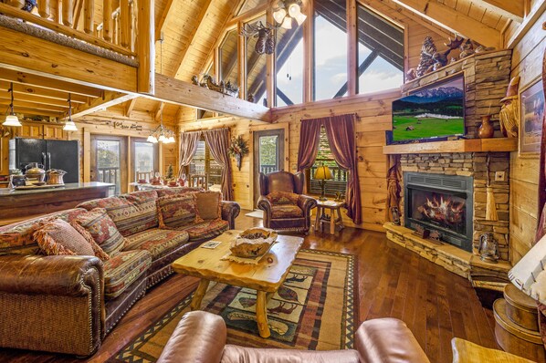 Large main level living room with fireplace. Vacations by fayla.
