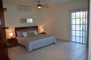 Second level master bedroom with balcony access and en suite bathroom