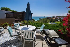 Patio for guests in lower unit. You can see and hear the waves..ahhh...