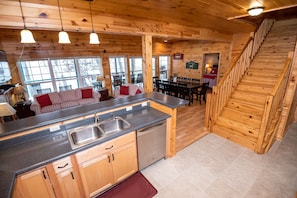 Kitchen opens to the great room and deck, with wonderful views of Stone Lake.