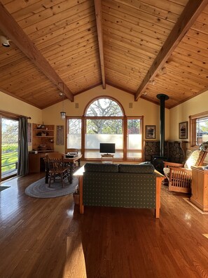The arched window looks out onto a 500 year old Valley Oak.