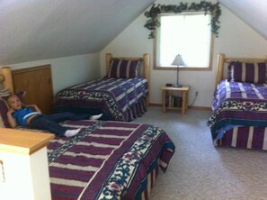 Loft sleeping quarters.1 queen bed and three twins (adding extra twin)

