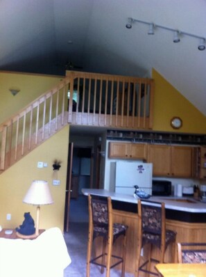 Open Kitchen with Island seating area and view of loft.