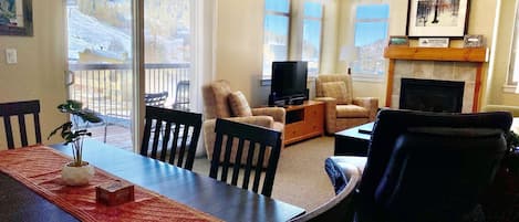 Dining room with slope views like no other units. New dining table set. 