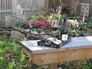 Enjoy some wine and cheese in landscaped yard