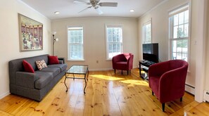 The sun filled living room is just off the kitchen. 