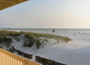 View from second floor balcony up the beach.