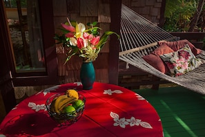 Porch table has four chairs.