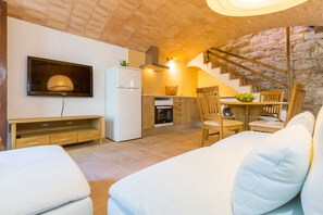 Sitting Area with TV and Kitchen, Stairs to Bedroom