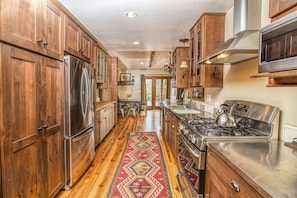 Kitchen area with stainless steel counter tops.